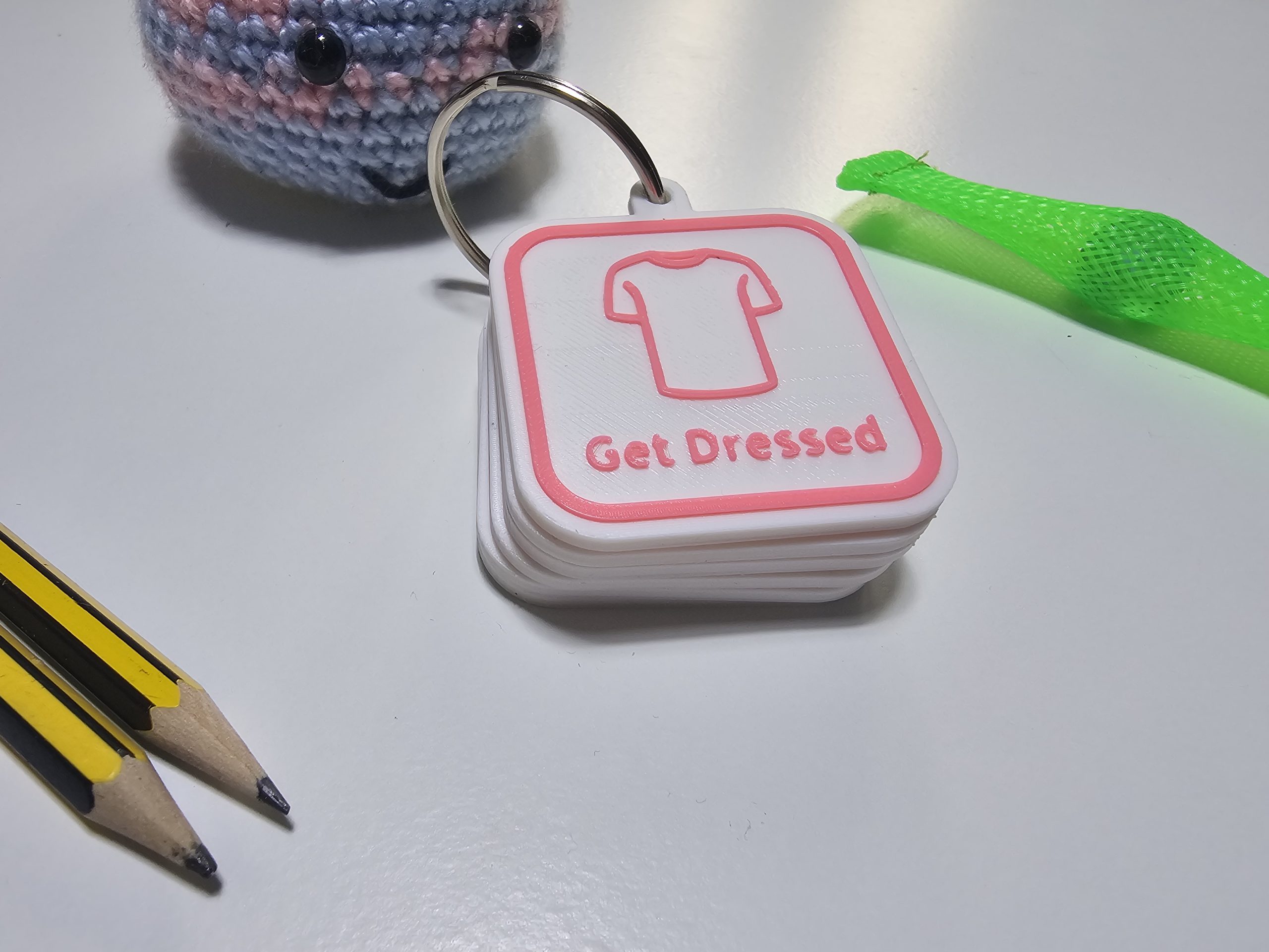 Get Dressed visual routine tag for autism morning routine with custom pink icon and border.