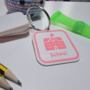 School visual communication tag with school icon for autism and SEN morning routine.
