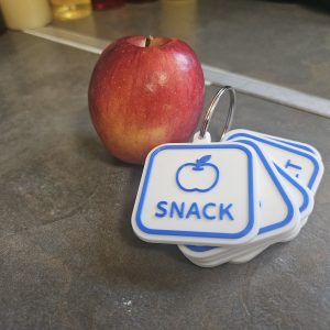 visual communication keyring showing snack request for autism support