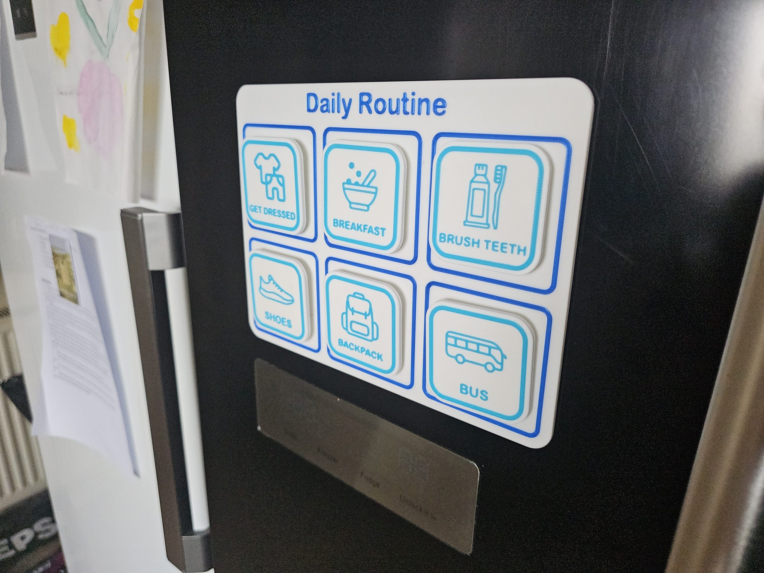 visual routine board mounted on fridge showing morning routine steps